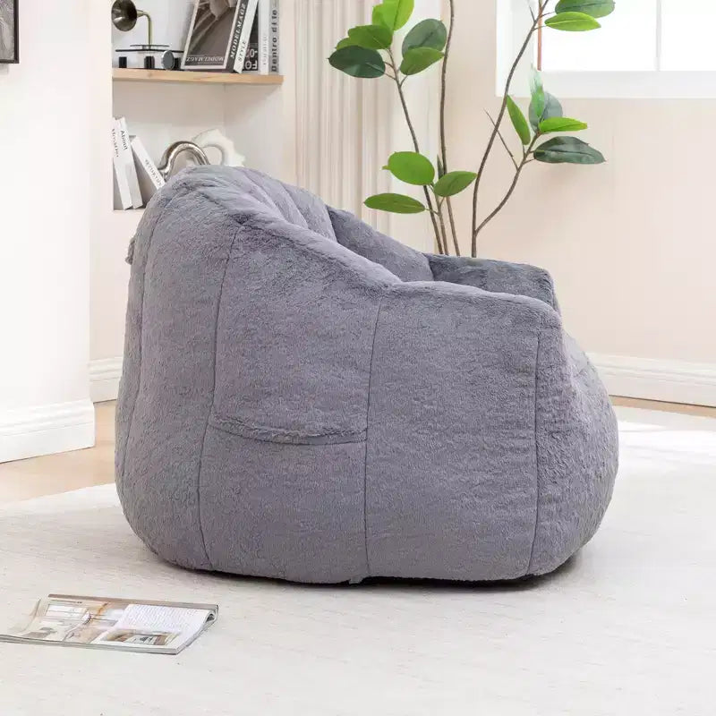 Pouf poire moderne en fausse fourrure avec accoudoirs